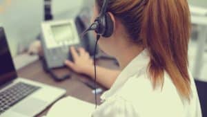 Person taking a business call on a headset